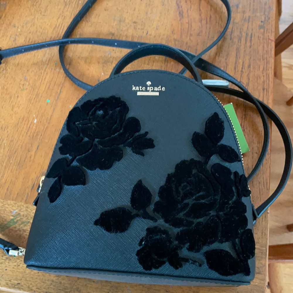Mini Kate Spade black flower embossed backpack. Convertible